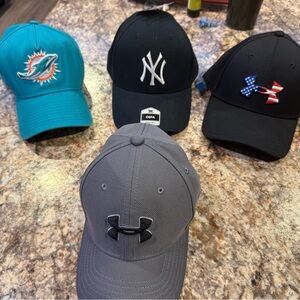 Under Armour Gray Cap and Black Freedom Cap.